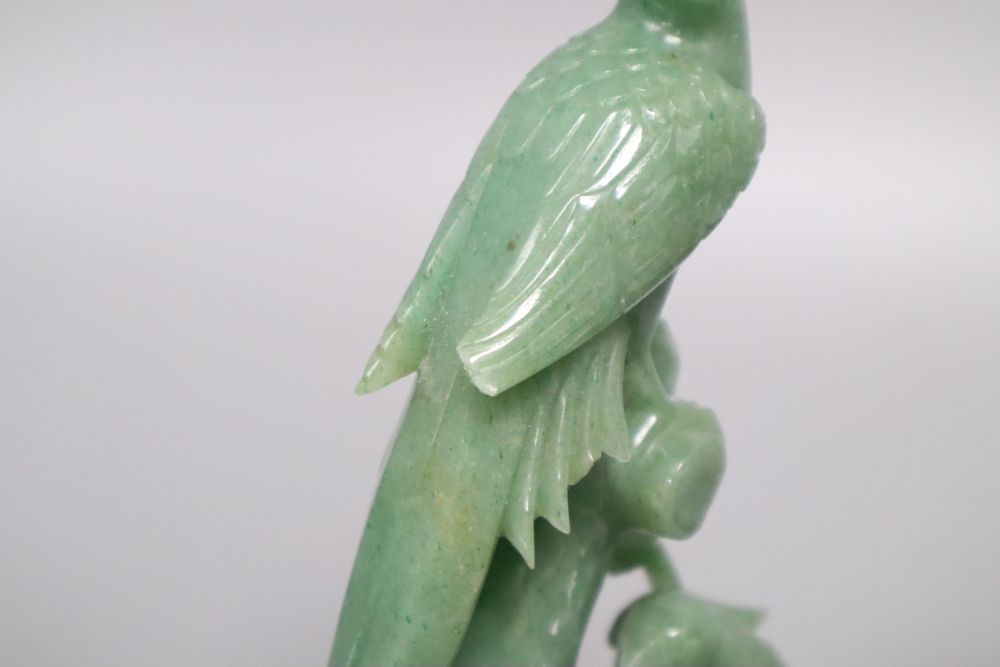 A Chinese green carved hardstone lidded jar, a carved bird group and a plated mirror, tallest 24cm